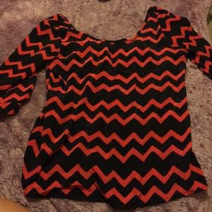 Like new black & red blouse with a bow on back